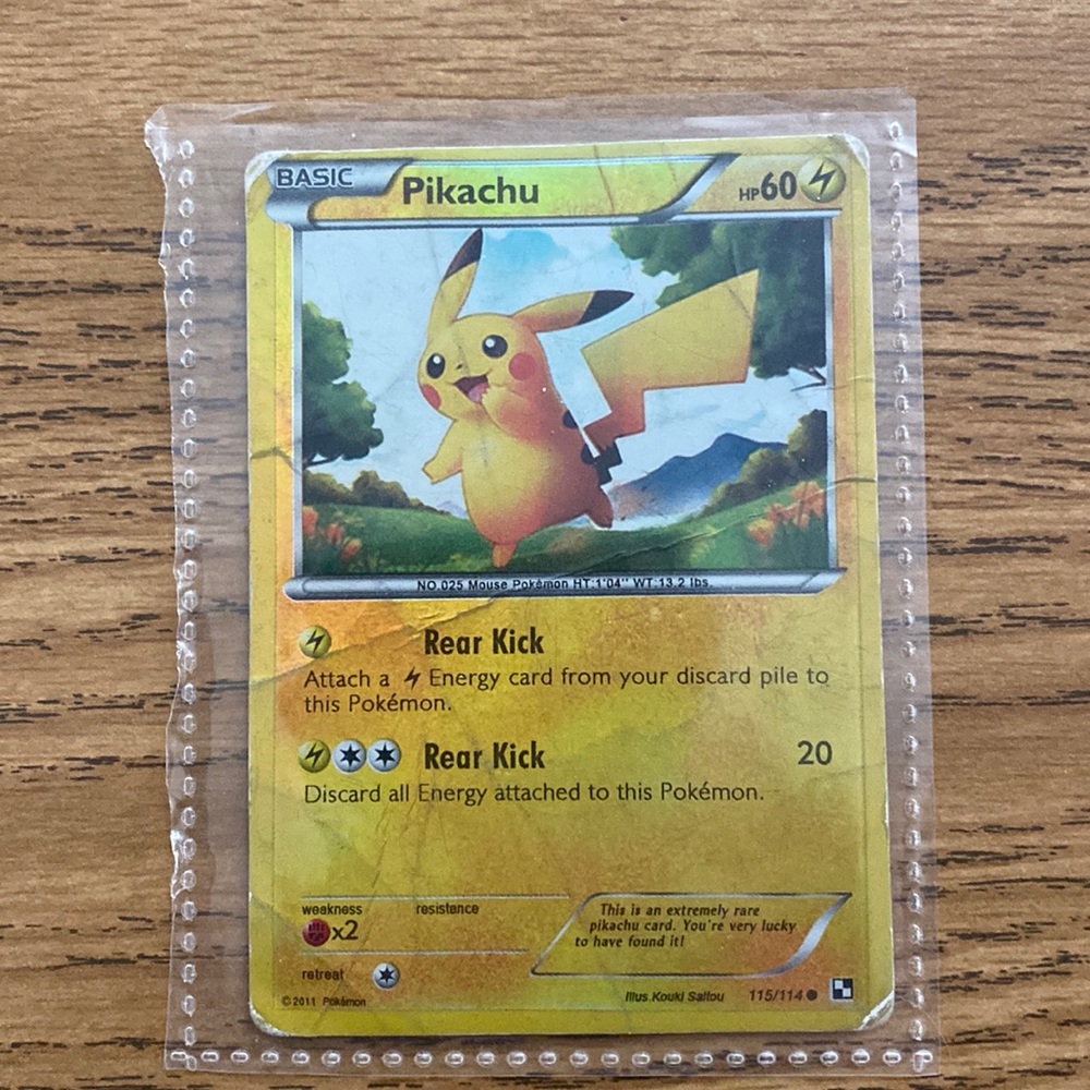 Pikachu Holo card very well played and loved. Has many crinkles and lines in it.